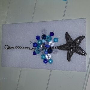 Handmade purse charm blue beads with silver starfish